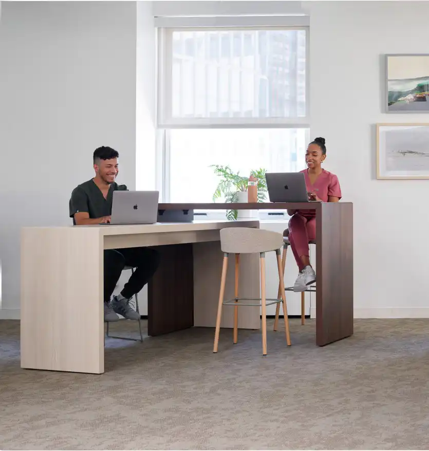 Shared touchdown areas allow caregivers to connect, document, and recharge between rounds. Flexible furniture supports both focused work and informal collaboration, fostering efficiency and team well-being.