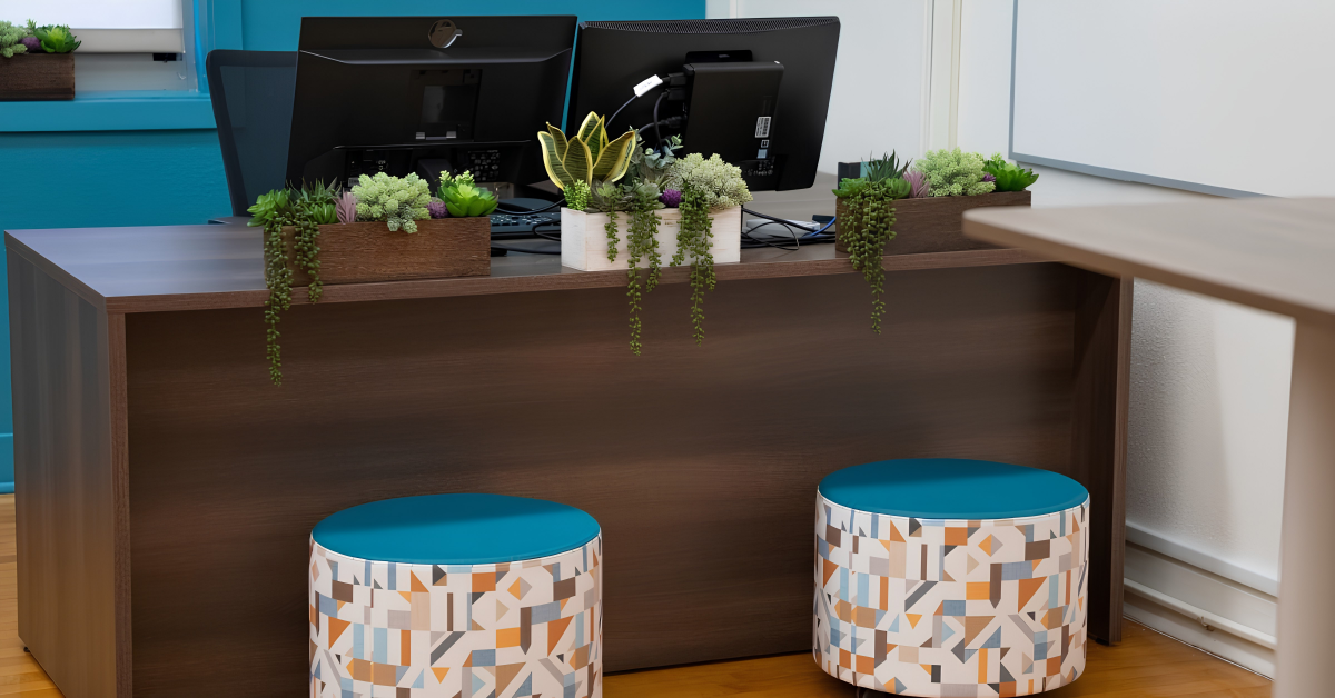 Teacher workspace with storage, technology, seating, and greenery